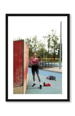 Athlete training in a park with boxing gloves and focus on fitness in an outdoor training environment