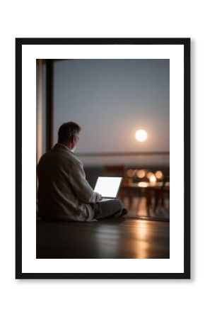 Nighttime Productivity Man Working on Laptop with Stunning Sunset View