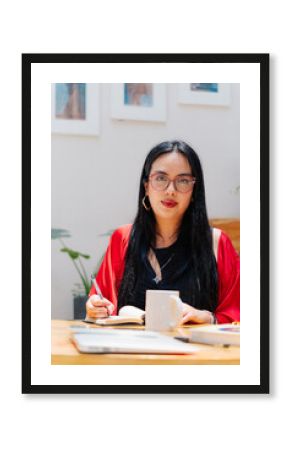 Portrait of a young woman in a modern office.
