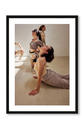 Dance rehearsal in a minimalist studio with expressive movements