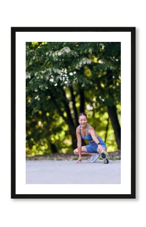 Woman Stretching Outdoors in Activewear Under Green Trees on a Sunny Day
