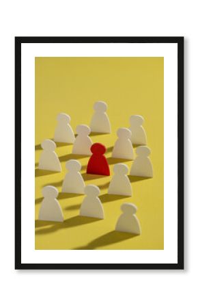Conceptual image of a leader standing out from the team