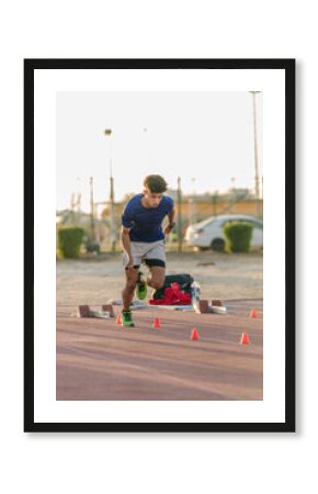 Male athlete running on track in Oman