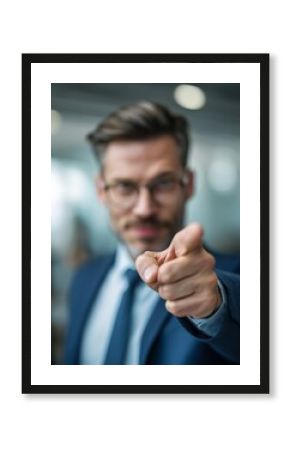 Businessman pointing forward assertively, emphasizing focus and direction during presentation.