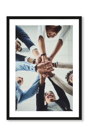 Hands stacked and piled showing team unity, strength or motivation among creative business colleagues from below. Excited, laughing and huddled group of inspired business people ready for success
