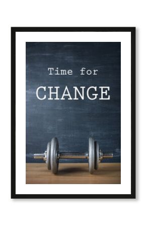 metal barbell on dark gray background and motivation text time for change