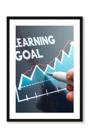 Hand Measuring Success with Learning Goal Chart for Educational Growth and Achievement