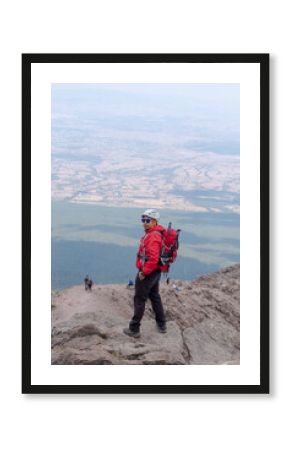 Mountaineer standing on malinche volcano summit 