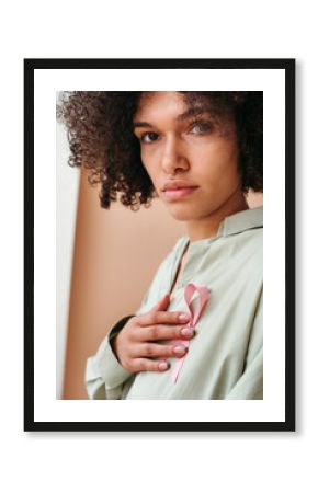 Embracing Hope With a Pink Ribbon in Soft Light