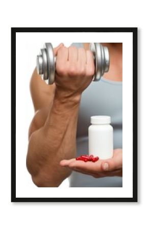 Male adult holding dumbbell and supplements for fitness motivation