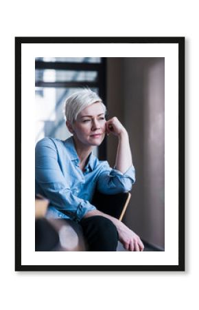 Portrait of a smiling manager in a modern office setting