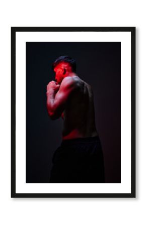 Boxer preparing for a match in dramatic lighting