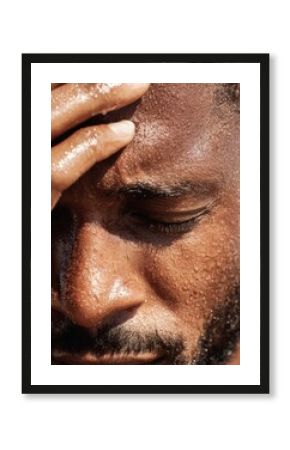 Businessman wiping sweat from his forehead, symbolizing stress, relief, and perseverance.