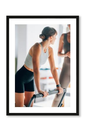 Two Women Engaged in a Pilates Workout