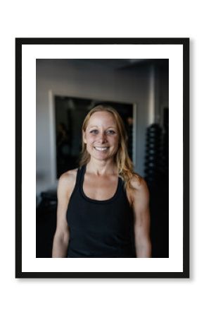 Smiling Woman Enjoying Workout at the Gym