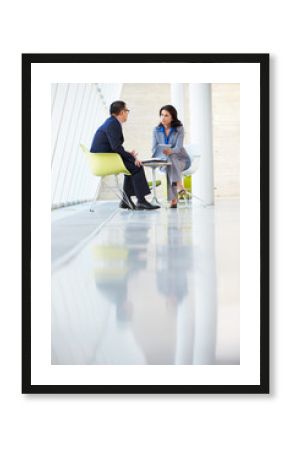 Businessman And Businesswoman Meeting In Modern Office