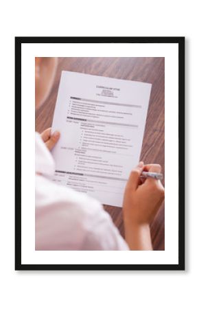 Young Businesswoman Reading Curriculum Vitae