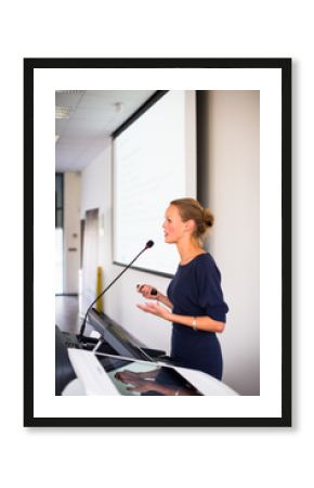 Pretty, young business woman giving a presentation