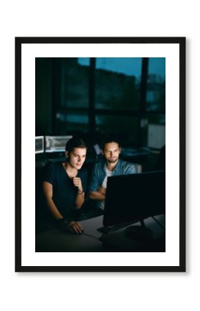 Programmers Working, Looking At Computer In Office.