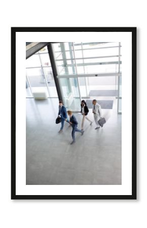 Group of multi ethnic business people on the way in building .