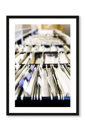 Multiple rows of filing cabinets in an office 