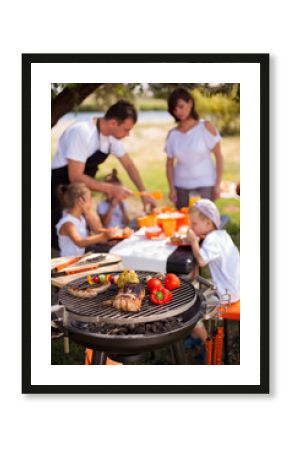 Family on vacation having barbecue