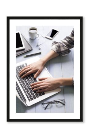 Woman using laptop on table 