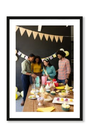 Celebrating birthday with cake and decorations, colleagues in office gathering together