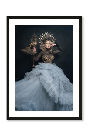 Gorgeous woman in a golden crown, Mythical creature, queen,. Photo in the studio. Concept for fairy tale, legend, theater, film