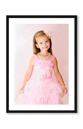 Portrait of cute smiling little girl in princess dress