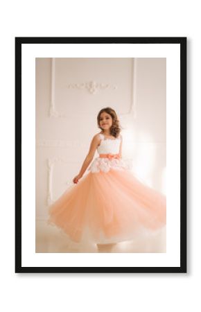 Happy little princess in beautiful dress walk though the big studio. spin around