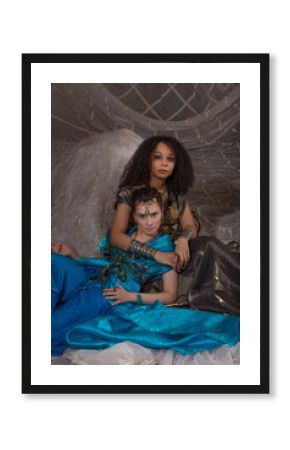 Oriental princess gathering - young women in elaborate Arabic costumes with rich decorative details