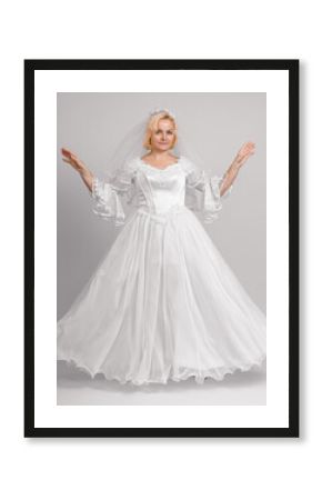 bride in white dress with puffy long hem, full length, studio shot