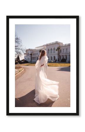 Long flowing wedding dress of the bride.