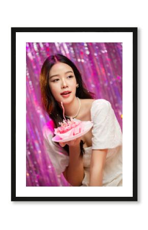 Happy beautiful Asian girl in princess dress showing birthday cake. Birthday princess photography theme is popular in social network.