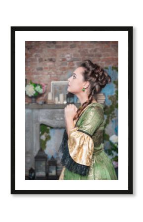 Praying beautiful woman in medieval dress