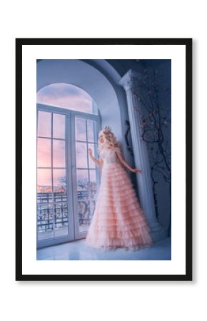 Fantasy beautiful medieval woman princess stands near window castle white room. Girl looking outdoor with hope . Pink long luxury dress. Lady queen wavy blonde hair. Vintage royal crown. Stay home 