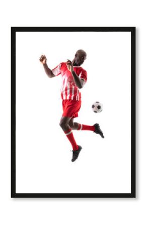African american young male soccer player controlling ball against white background