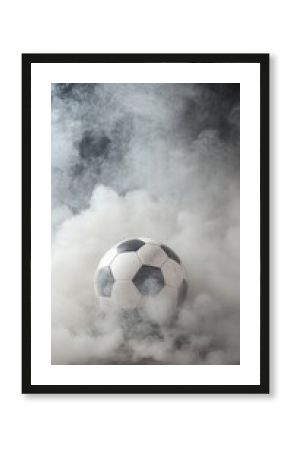 A soccer ball is in the middle of a cloud of smoke