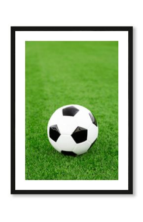 Traditional soccer ball on soccer field