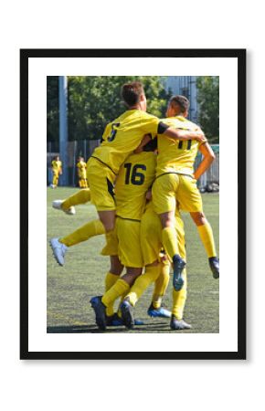 Young soccer players are happy after winning the match