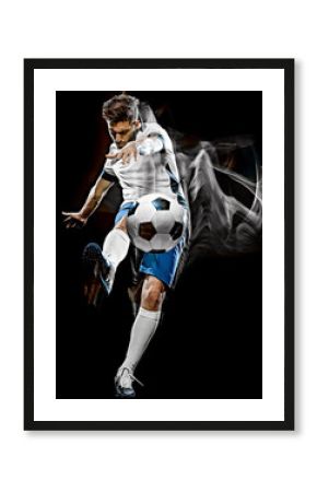 one caucasian soccer player man isolated on black background with light painting speed effect
