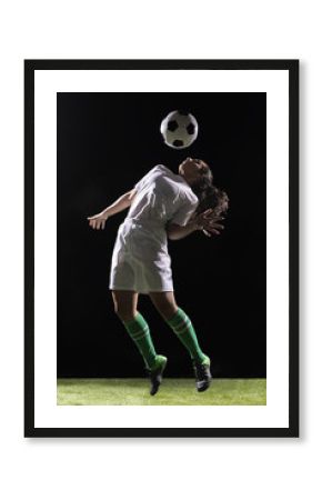 Beautiful woman playing with soccer ball