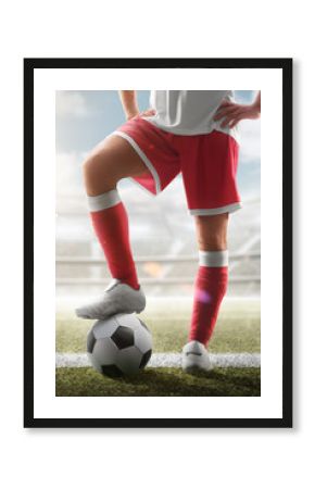 Soccer closeup. Leg of soccer player on the ball. Soccer background. Day stadium. Soccer vertical. Sport