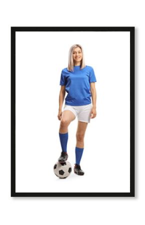Full length portrait of a female football player with a soccer ball and smiling