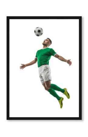 Player in vibrant green jersey performs an impressive jump to head a soccer ball during a competitive match in a dynamic display of skill