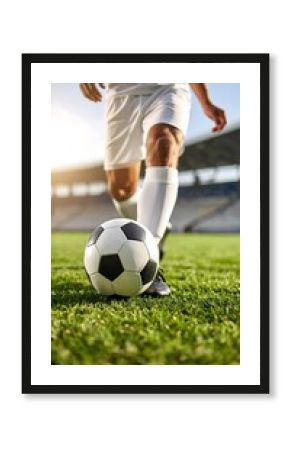 Low-angle close-up of soccer player and ball