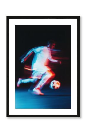 soccer player in full action chasing the ball with motion blur effects, illuminated by vibrant red and blue tones, showcasing speed, agility, and the energy of modern sports visuals