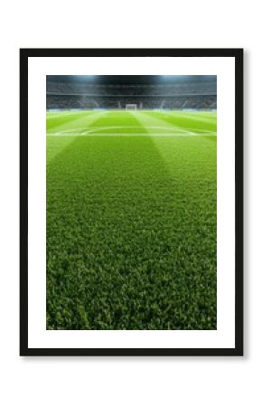 Illuminated soccer field ready for evening match with vibrant green grass and empty stadium in the background