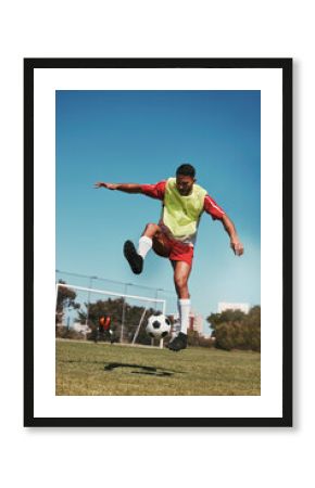 Sport, fitness and soccer training with soccer player in soccer ball power kick on a soccer field, energy, exercise and passion. Sports, football and football player ball practice on football field